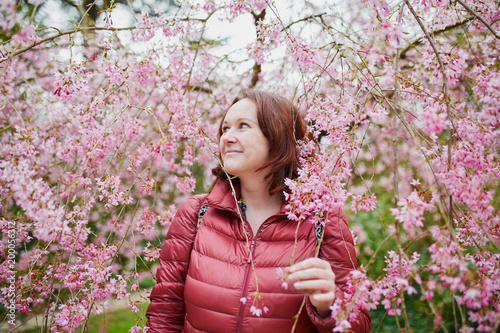 woman enjoying cherry blossom season at spring