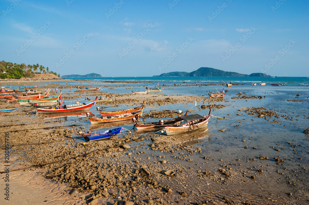 national fishing boats on the shore of the Indian Ocean phuket thailand