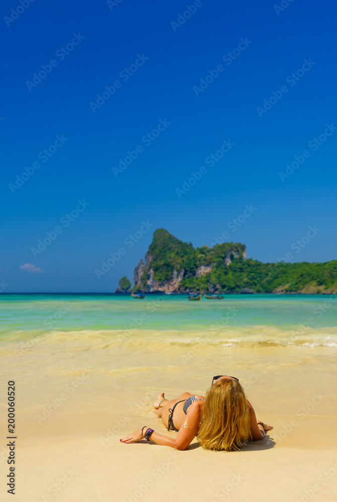 woman resting at the tropical beach of Phi Phi Don