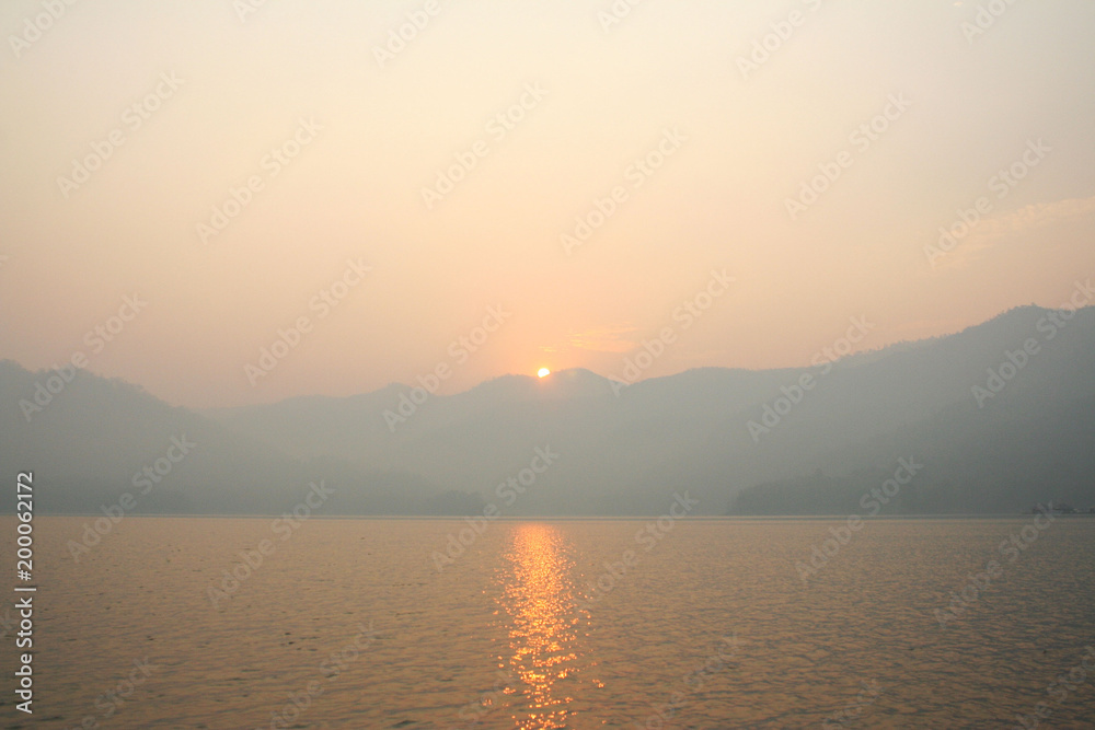 sunrise view with mountains and lake landscape in the morning natural outdoor background