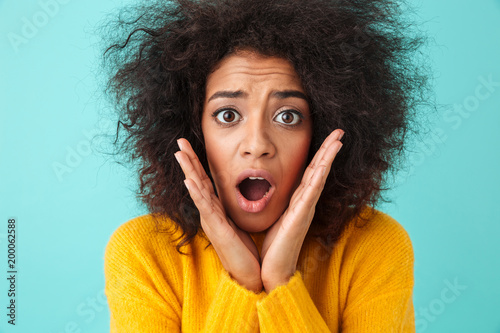 Bilde på lerret Image closeup of emotional woman grabbing her face and reacting with open mouth
