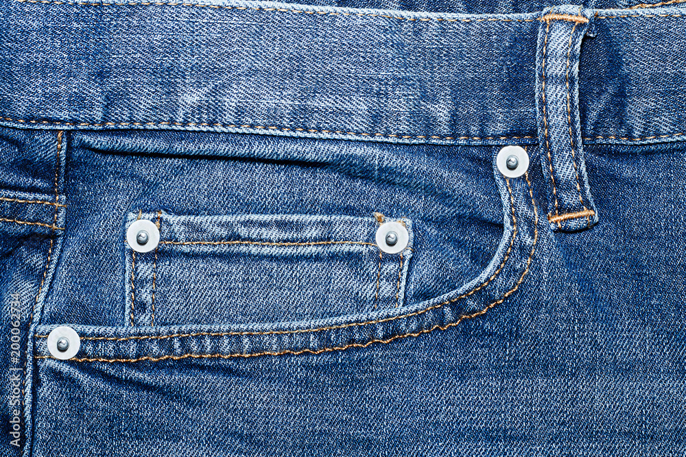 Fragment of the front of the classic blue jeans Fragment of the front of the classic blue jeans