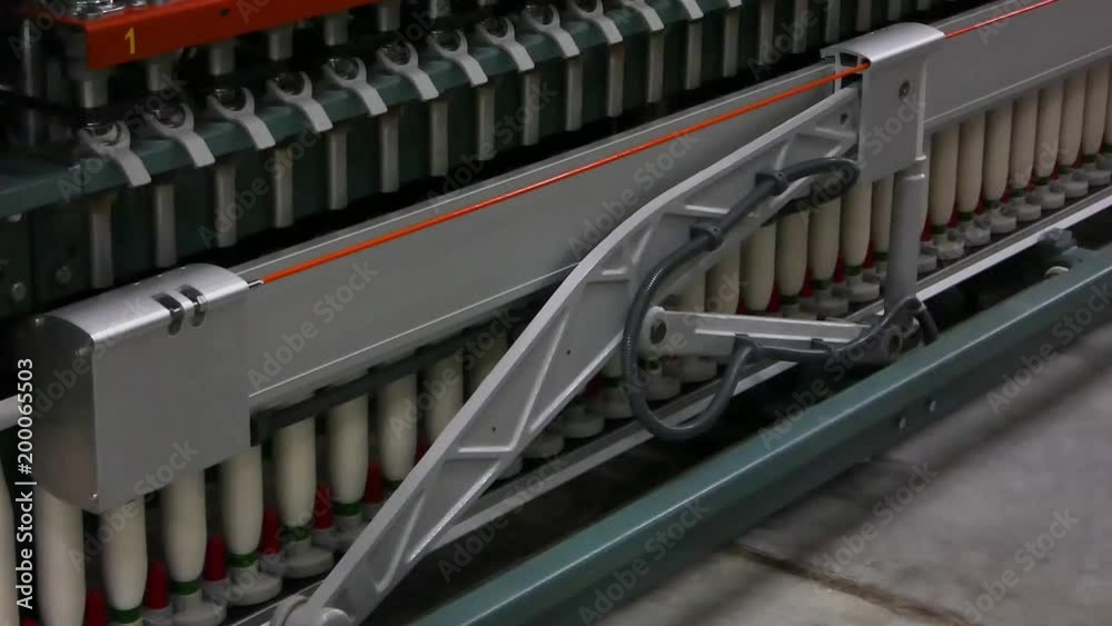 Machinery and equipment in the workshop for the production of thread. interior of industrial textile factory. the camera is stationary Machinery and equipment in the workshop for the production of thread. interior of industrial textile factory. the camera is stationary
