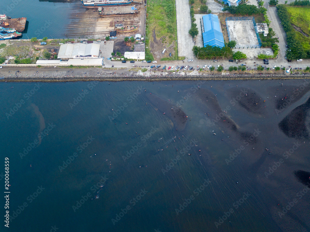 Dock station for tradditional shipyard with lot of boats and ships, photo from drone at bird eye view