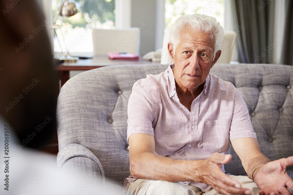 Senior man with depression having therapy with psychologist Senior man with depression having therapy with psychologist