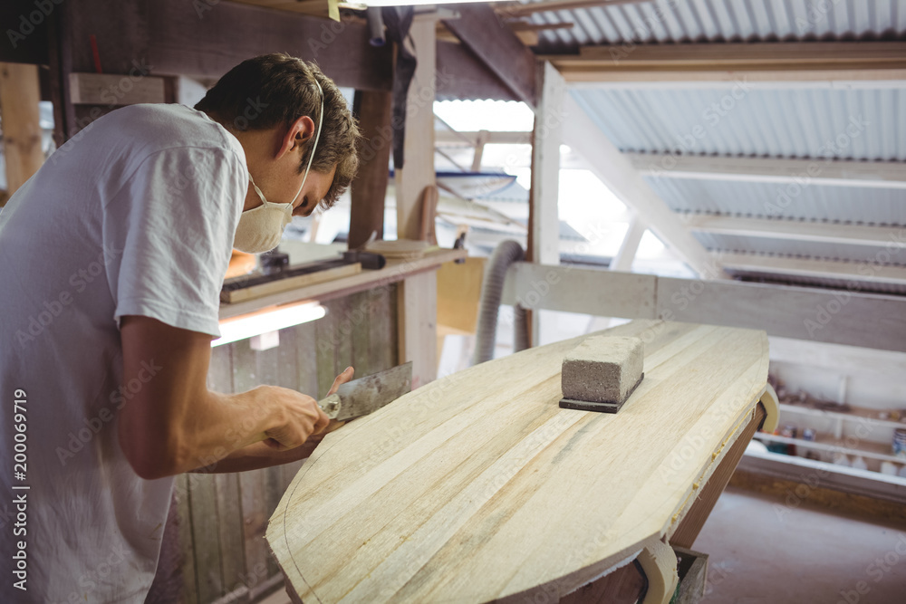 Man making surfboard Man making surfboard