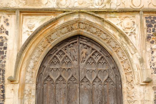 Details of the entrance to the Church of St Michael Coslany with remarkable display of 15th Century decorative flint and stonework, Norwich, Norfolk, UK