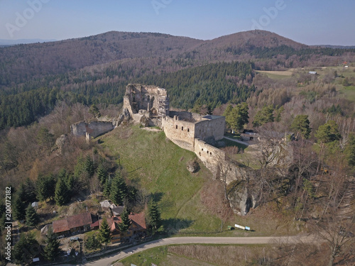Wallpaper Mural Kamenets, near Odjykon, Poland -april 8, 2018: Ancient ruins of a medieval castle against the backdrop of a natural landscape of the central strip of central Europe. View of drone. Panorama of fly. Torontodigital.ca