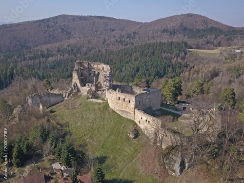 Kamenets, near Odjykon, Poland -april 8, 2018: Ancient ruins of a medieval castle against the backdrop of a natural landscape of the central strip of central Europe. View of drone. Panorama of fly.