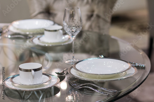 Plates and glasses on the table. Luxurious serving