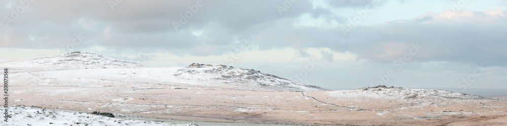 Panoramic view of Dartmoor tors in the snow Dartmoor national park uk