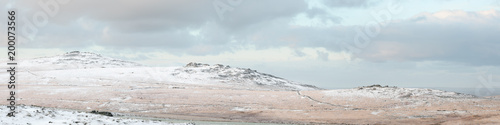 Panoramic view of Dartmoor tors in the snow Dartmoor national park uk