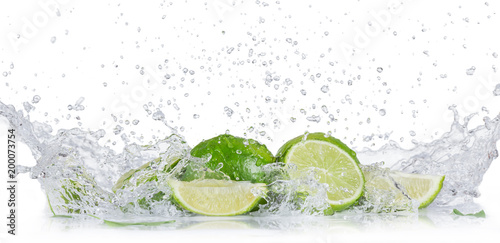 Fresh limes with water splash