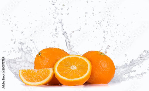 Fresh oranges with water splash