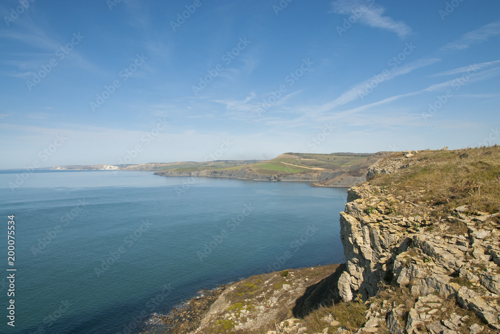 Afternoon spring sunshine over Jurassic Coast from St Albans or Adhelms Head, Purbeck, Dorset, UK