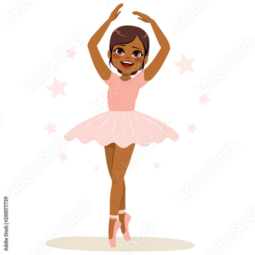 Sweet young African American teenager girl ballerina wearing pink tutu and dancing