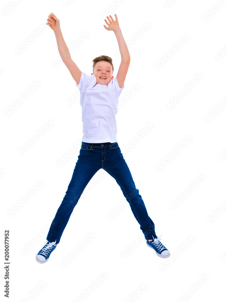 A little boy of school age jumps. A little boy of school age jumps.