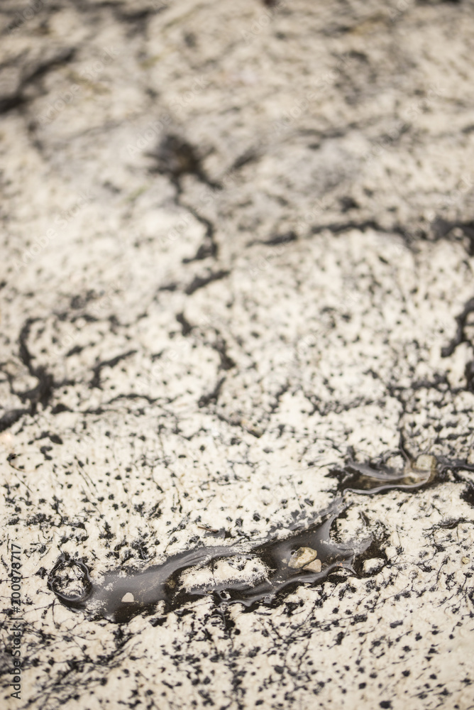 Close-up photo of natural white and black antique stone wall