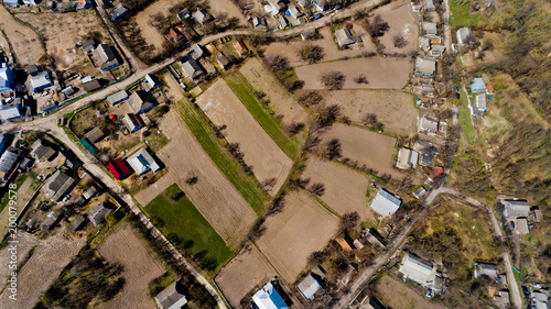 Top view of typical village in the early spring. Aerial view.