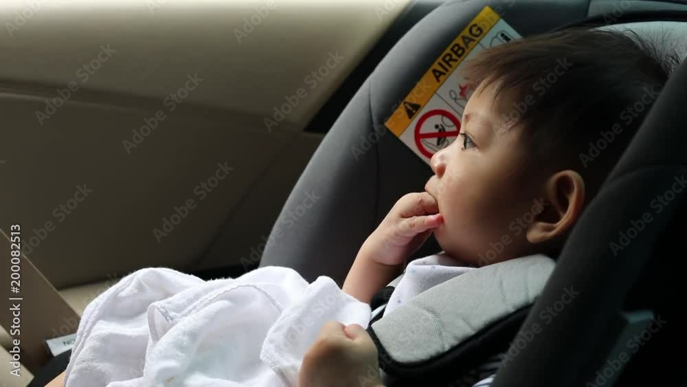 baby sitting on car seat driving road trip travel transportation baby sitting on car seat driving road trip travel transportation