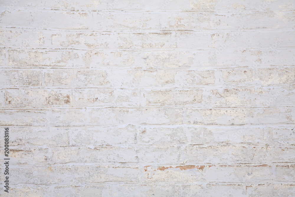 Old scratched white brick wall. Texture. Old scratched white brick wall. Texture.
