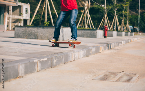 Skateboarder riding skateboard going down the step © lzf