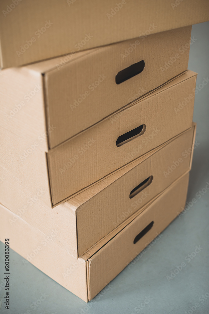close up view of cardboard boxes in room close up view of cardboard boxes in room