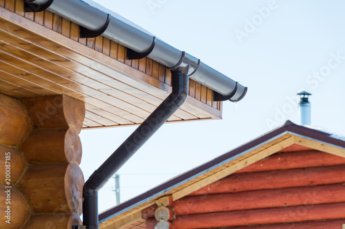 Drainage of a wooden house. Technology.Communications. Building.