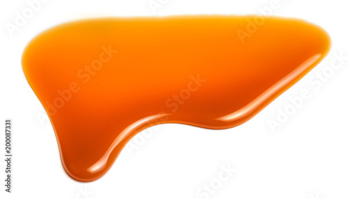 Bild auf Leinwand Pouring caramel sauce isolated on white background.
