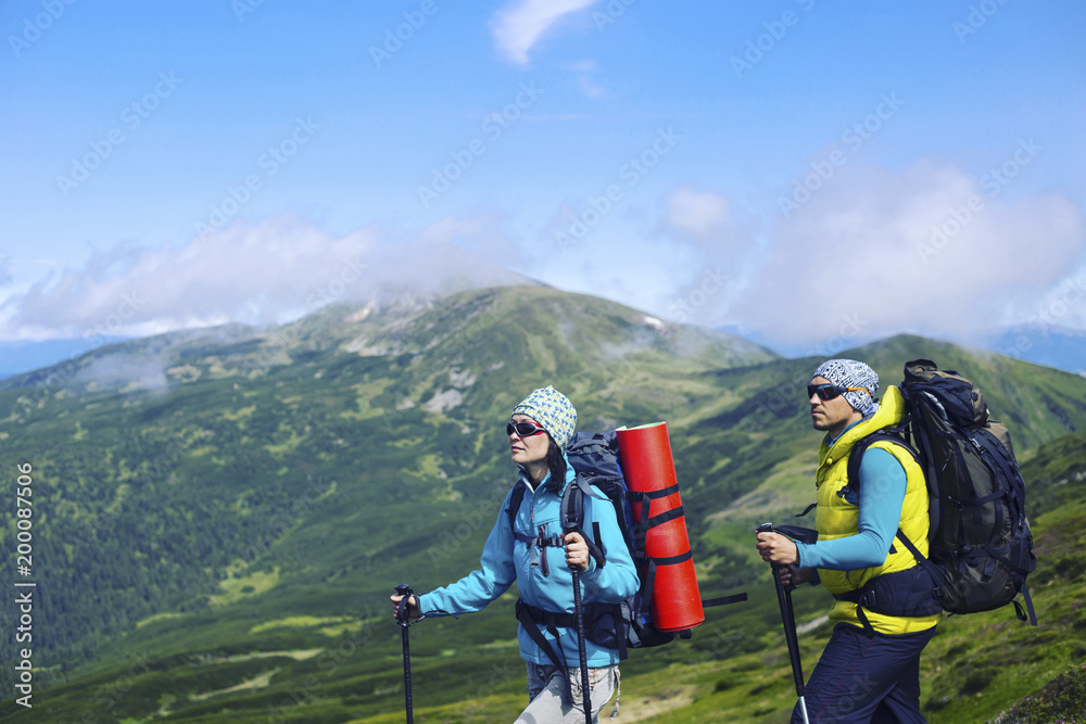 Summer hike in the mountains with a backpack and tent. Summer hike in the mountains with a backpack and tent.