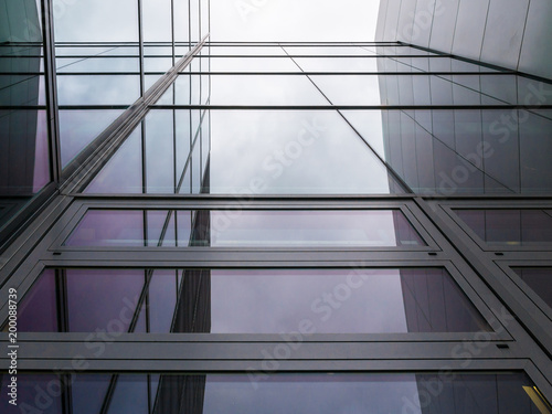 The glass architecture in city against a sky
