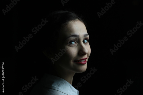 a pretty girl in a scarf with a sweet smile