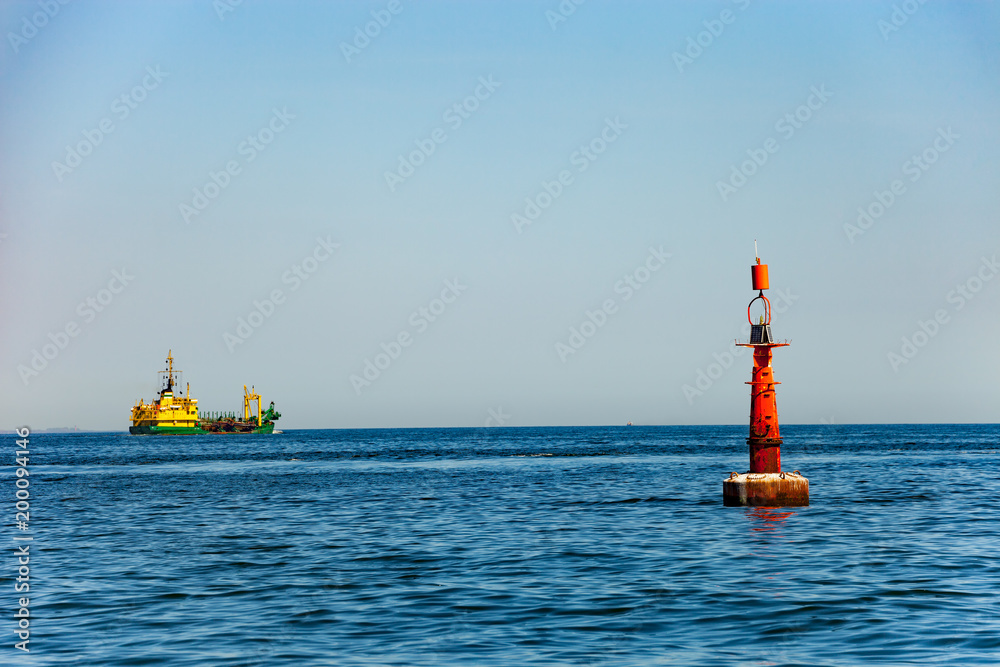 Navigation buoy at the edge of a fairway.