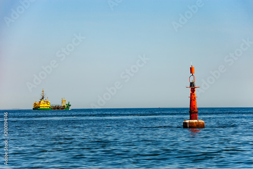 Obraz na płótnie Navigation buoy at the edge of a fairway. w salonie