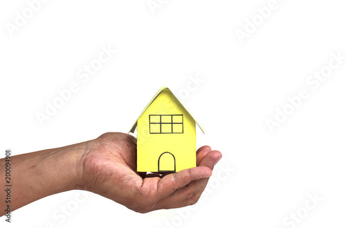 house in human hands on a white background