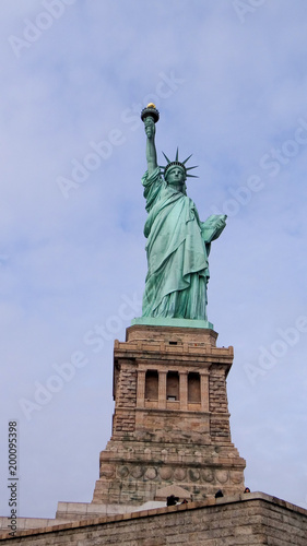 Statue of Liberty in New York in front of blue sky  Manhattan  New York City  famous lady