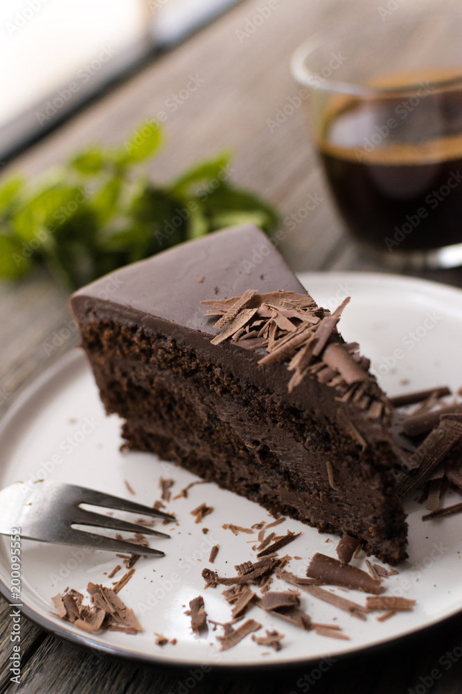 chocolate cake on wood background. chocolate cake on wood background.