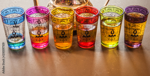 arabic teapot with colorful glasses