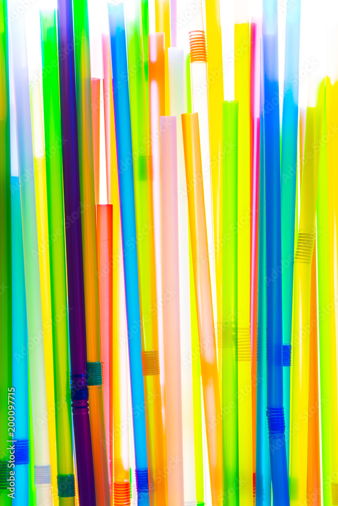 Colorful drinking straws on white background.