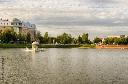 Astrakhan, Russia - a swan lake in the center of the city. © lanapopoudi