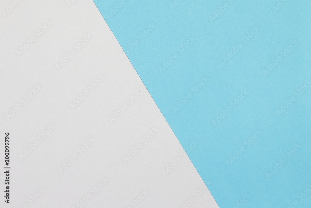 Two color paper with blue and white Overlap on the floor And split half of the image. background Two color paper with blue and white Overlap on the floor And split half of the image. background