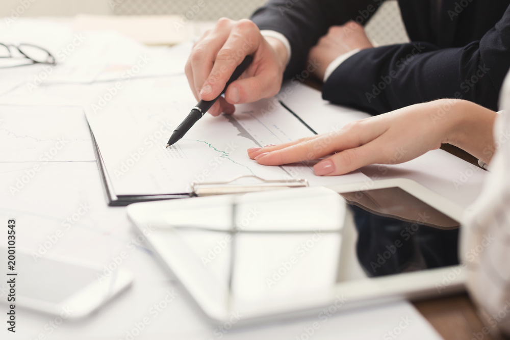 Business colleagues using tablet and working with documents Business colleagues using tablet and working with documents