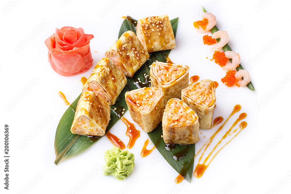 Sushi roll turned on a white background. Sushi Japanese food in a restaurant. Japanese restaurant menu. Roll in an omelette isolated on white background. Sushi roll turned on a white background. Sushi Japanese food in a restaurant. Japanese restaurant menu. Roll in an omelette isolated on white background.