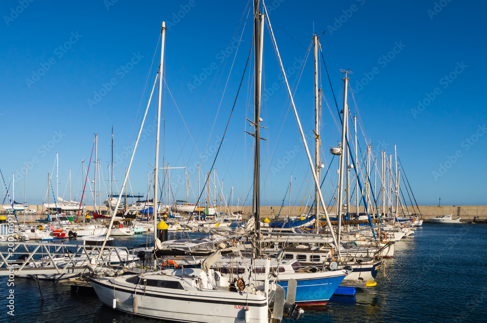 Marina of Los Abrigados filled with sailboats on the island of Tenerife in Spain
