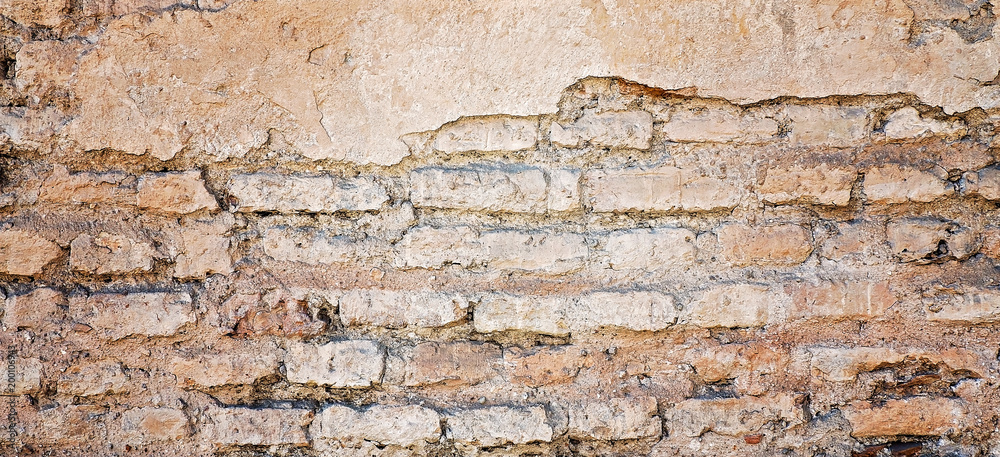Old damaged rustic brick wall with plaster texture background Old damaged rustic brick wall with plaster texture background