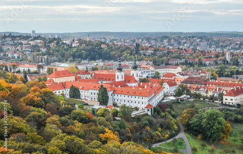 Prague, Czech Republic - October 10, 2017: Bright and beautiful autumn view on Prague Castle, Old town and city center with old red roofs, Prague, Czech Republic
