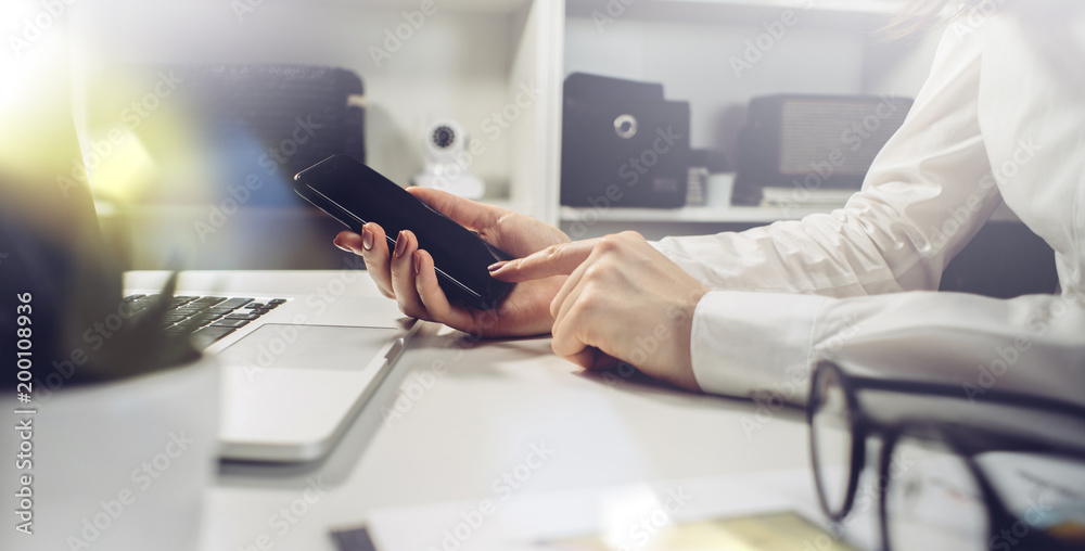 Hands on laptop side view