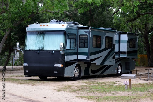 Recreational vehicle at campsite background