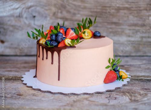 homemade cake with cheese cream and strawberries photo