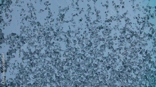 Time lapse shot of snow and ice melting on the glass